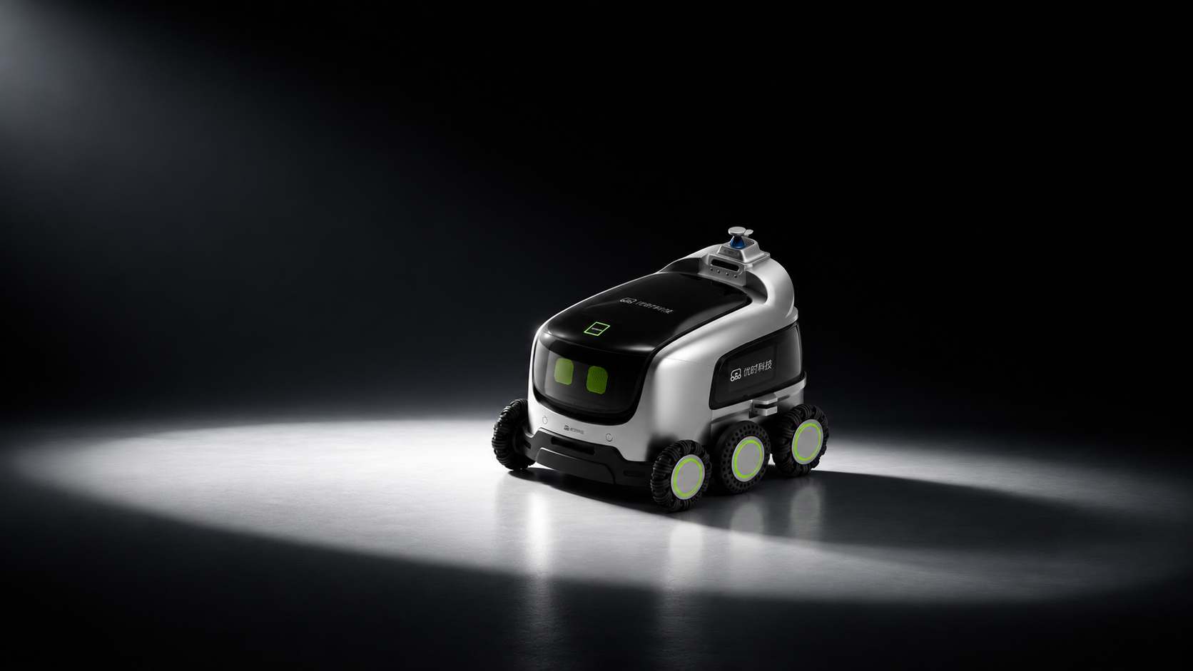 A Yours autonomous mobile robot lit against a dark studio background